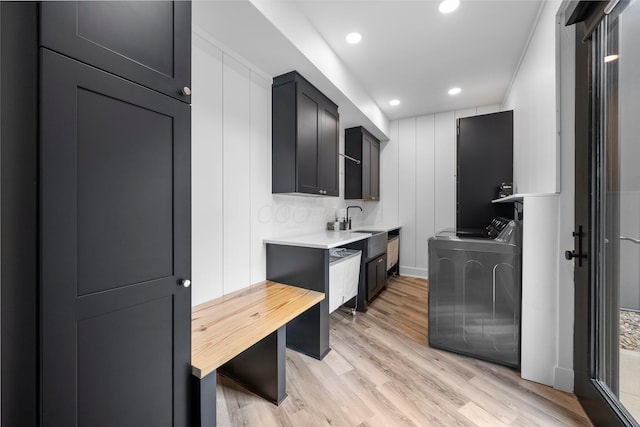 3226 Bean Oller Rd, Delaware, OH 43015 - laundry room featuring light wood-style floors, wet bar, recessed lighting, and washing machine and clothes dryer