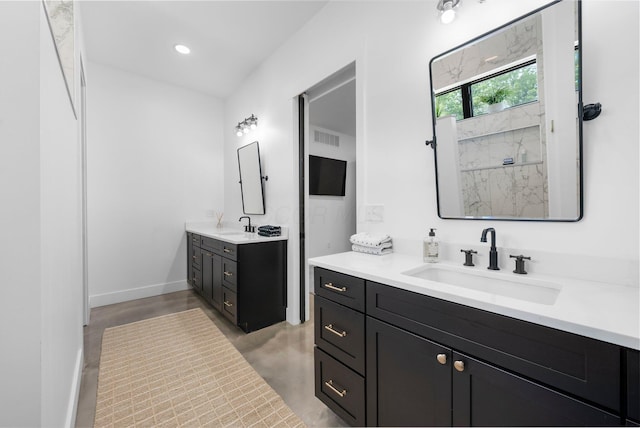 3226 Bean Oller Rd, Delaware, OH 43015 - full bathroom with two vanities, concrete floors, a marble finish shower, baseboards, and recessed lighting