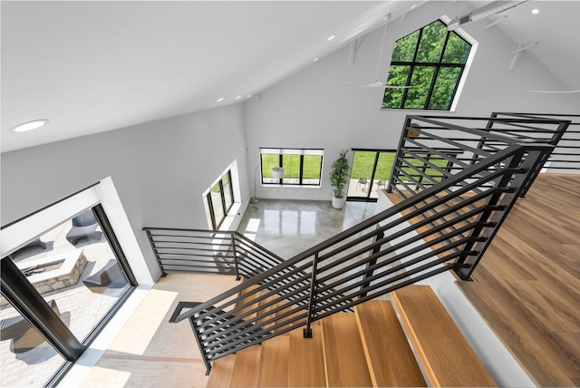 3226 Bean Oller Rd, Delaware, OH 43015 - stairway with high vaulted ceiling, plenty of natural light, recessed lighting, and wood finished floors