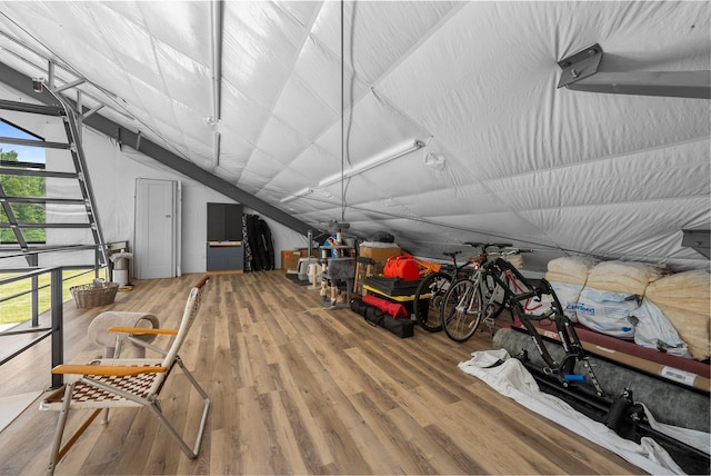 3226 Bean Oller Rd, Delaware, OH 43015 - interior space with wood finished floors, a garage, and vaulted ceiling