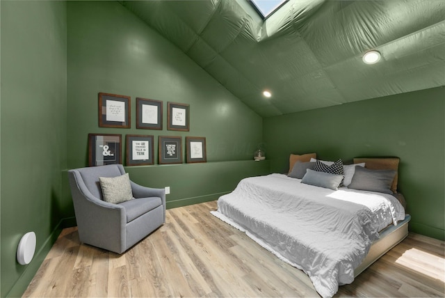 3226 Bean Oller Rd, Delaware, OH 43015 - bedroom with vaulted ceiling, wood finished floors, baseboards, and a skylight