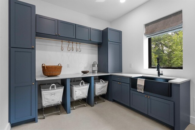 3226 Bean Oller Rd, Delaware, OH 43015 - kitchen with a sink, light countertops, light carpet, and blue cabinets