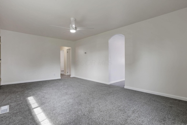 46 S 24th St, Newark, OH 43055 - spare room with ceiling fan, dark carpet, arched walkways, and baseboards