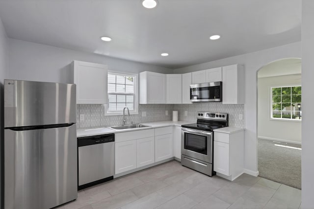 46 S 24th St, Newark, OH 43055 - kitchen with stainless steel appliances, a sink, white cabinets, light countertops, and recessed lighting