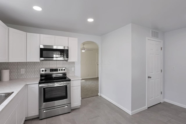 46 S 24th St, Newark, OH 43055 - kitchen featuring stainless steel appliances, white cabinetry, tasteful backsplash, baseboards, and recessed lighting