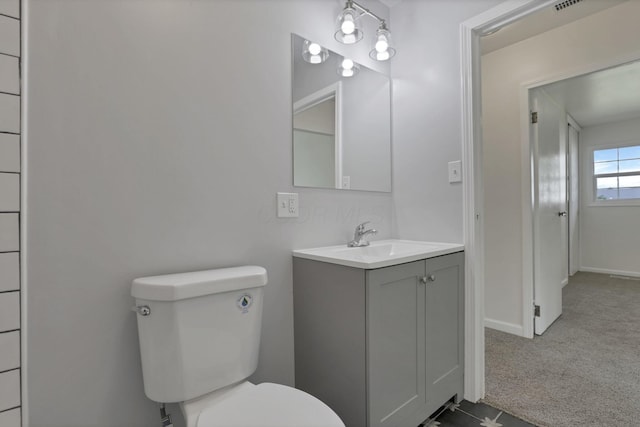 46 S 24th St, Newark, OH 43055 - bathroom featuring vanity, toilet, and baseboards