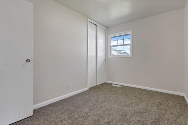 46 S 24th St, Newark, OH 43055 - unfurnished bedroom featuring carpet floors, a closet, and baseboards