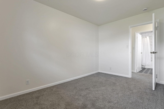 46 S 24th St, Newark, OH 43055 - unfurnished room with dark colored carpet, baseboards, and a smoke detector