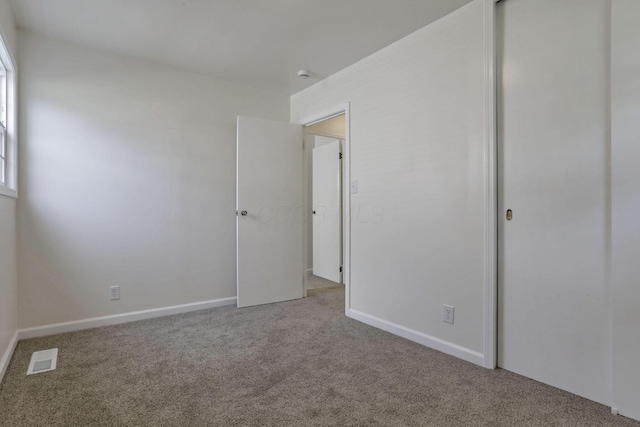 46 S 24th St, Newark, OH 43055 - unfurnished bedroom with carpet, a closet, and baseboards