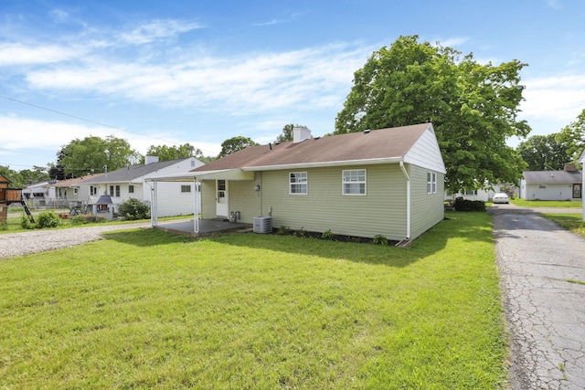 46 S 24th St, Newark, OH 43055 - view of front of property featuring a front lawn, a chimney, a patio area, and a residential view