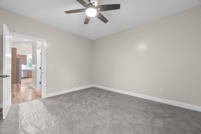 13567 Magers Rd, Howard, OH 43028 - unfurnished room with light carpet, a ceiling fan, and baseboards