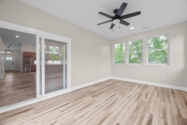 13567 Magers Rd, Howard, OH 43028 - empty room featuring plenty of natural light, light wood-type flooring, a ceiling fan, baseboards, and recessed lighting