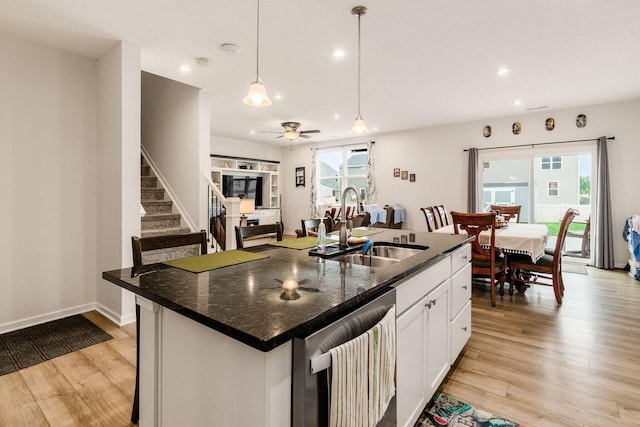 99 Hutchison St, South Bloomfield, OH 43103 - kitchen featuring dishwasher, light wood finished floors, white cabinetry, recessed lighting, and a kitchen island with sink