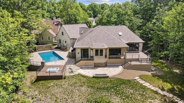 5633 Travis Pointe Ct, Westerville, OH 43082 - rear view of house with a sunroom, roof with shingles, stairway, a patio area, and an outdoor pool
