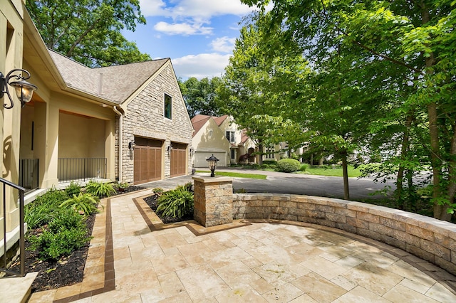 5633 Travis Pointe Ct, Westerville, OH 43082 - view of patio / terrace featuring a garage
