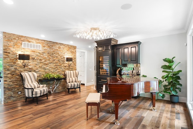 5633 Travis Pointe Ct, Westerville, OH 43082 - living area with baseboards, ornamental molding, wood finished floors, a chandelier, and recessed lighting