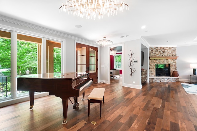 5633 Travis Pointe Ct, Westerville, OH 43082 - living area featuring a chandelier, ornamental molding, dark wood-type flooring, baseboards, and french doors