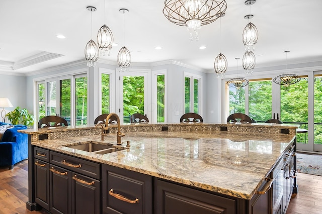 5633 Travis Pointe Ct, Westerville, OH 43082 - kitchen featuring a sink, healthy amount of natural light, a spacious island, hardwood / wood-style flooring, and recessed lighting