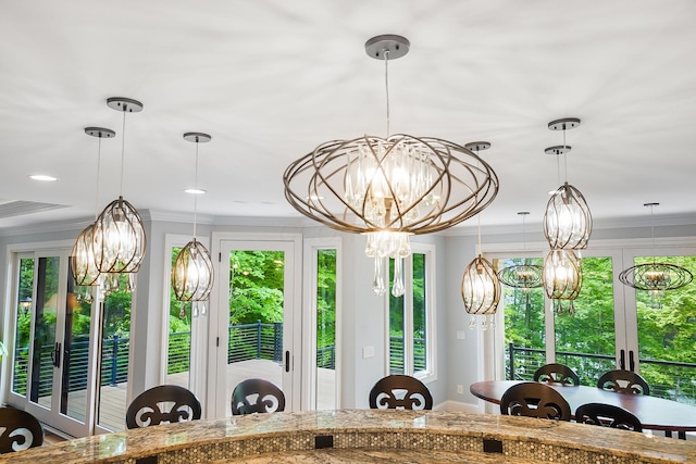 5633 Travis Pointe Ct, Westerville, OH 43082 - dining area with a chandelier, ornamental molding, healthy amount of natural light, and recessed lighting