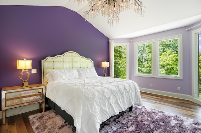 5633 Travis Pointe Ct, Westerville, OH 43082 - bedroom with vaulted ceiling, wood finished floors, and baseboards