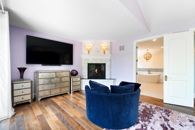 5633 Travis Pointe Ct, Westerville, OH 43082 - living area featuring wood finished floors and a warm lit fireplace