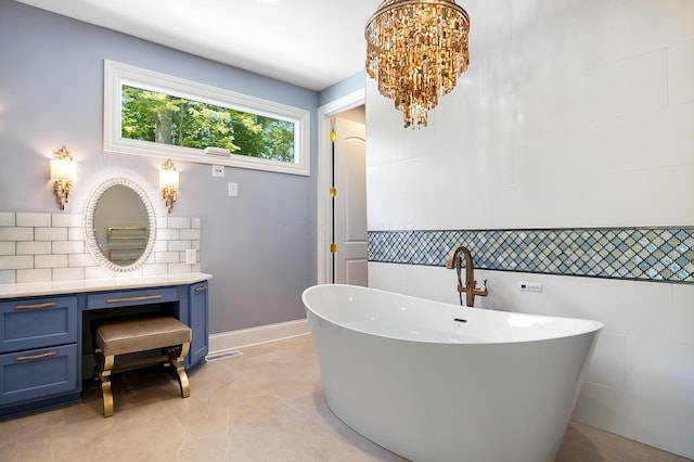 5633 Travis Pointe Ct, Westerville, OH 43082 - full bath with vanity, a soaking tub, backsplash, tile patterned floors, and a chandelier