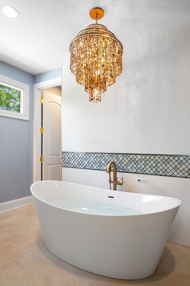 5633 Travis Pointe Ct, Westerville, OH 43082 - bathroom featuring a freestanding bath, tile walls, and baseboards