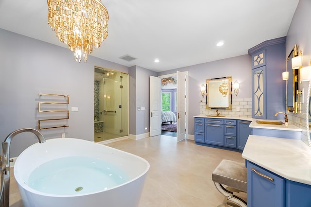 5633 Travis Pointe Ct, Westerville, OH 43082 - full bathroom featuring a stall shower, vanity, backsplash, a soaking tub, and recessed lighting