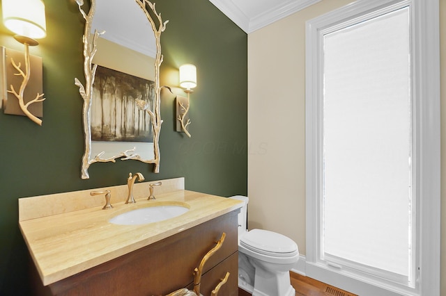 5633 Travis Pointe Ct, Westerville, OH 43082 - half bathroom featuring toilet, vanity, crown molding, and wood finished floors