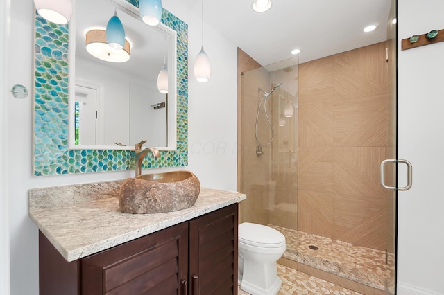 5633 Travis Pointe Ct, Westerville, OH 43082 - bathroom featuring a shower stall, vanity, recessed lighting, and toilet