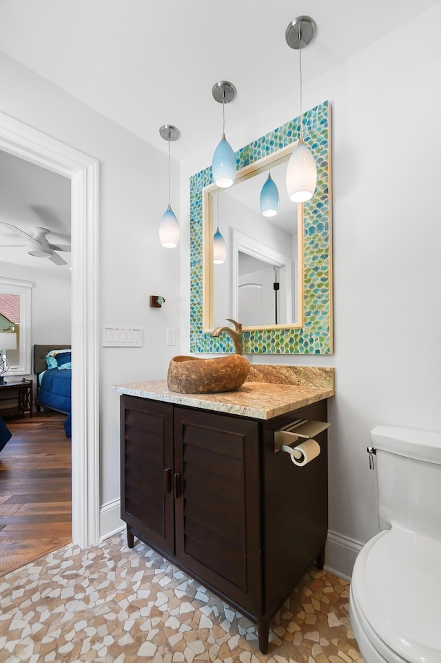 5633 Travis Pointe Ct, Westerville, OH 43082 - bathroom featuring vanity, toilet, ensuite bath, and baseboards