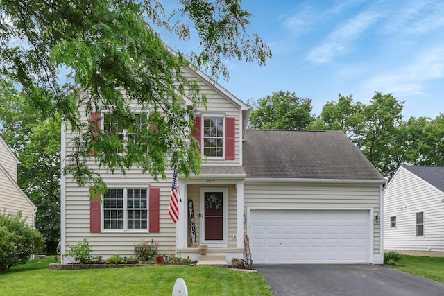 5035 Dietrich Ave, Orient, OH 43146 - traditional-style house featuring driveway, a garage, a front yard, and a shingled roof