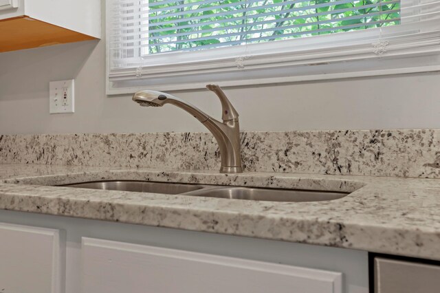 5035 Dietrich Ave, Orient, OH 43146 - kitchen view of a sink, white cabinetry, and light stone countertops