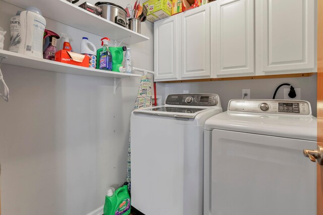5035 Dietrich Ave, Orient, OH 43146 - laundry area with washer and clothes dryer and cabinet space