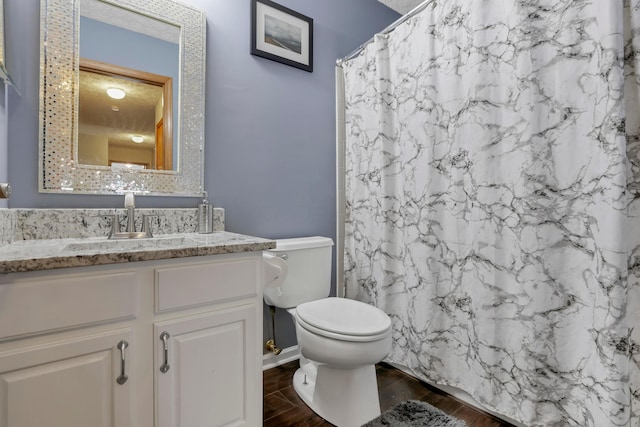 5035 Dietrich Ave, Orient, OH 43146 - full bathroom with toilet, vanity, wood finished floors, and a shower with curtain