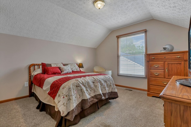 5035 Dietrich Ave, Orient, OH 43146 - bedroom with a textured ceiling, lofted ceiling, light colored carpet, and baseboards
