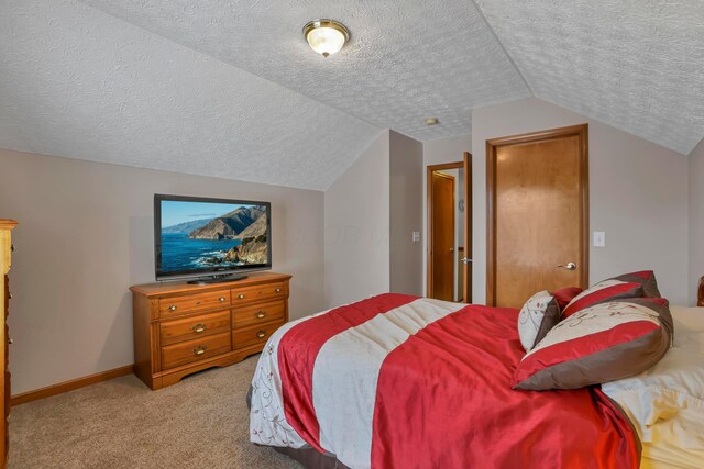 5035 Dietrich Ave, Orient, OH 43146 - bedroom featuring a textured ceiling, lofted ceiling, light carpet, and baseboards