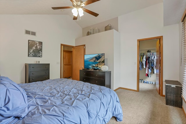5035 Dietrich Ave, Orient, OH 43146 - carpeted bedroom with high vaulted ceiling, a walk in closet, a closet, ceiling fan, and baseboards