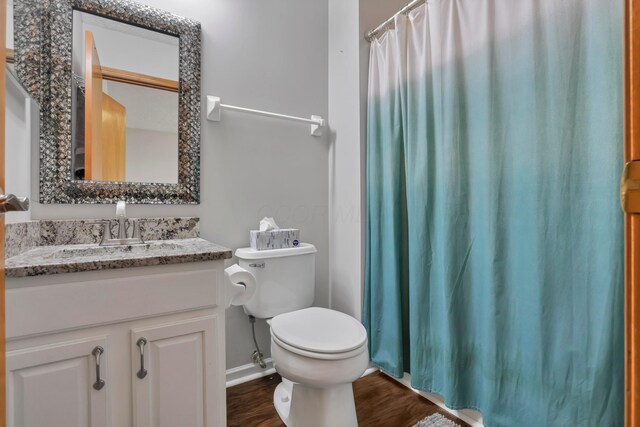5035 Dietrich Ave, Orient, OH 43146 - full bathroom with toilet, wood finished floors, vanity, a shower with curtain, and baseboards