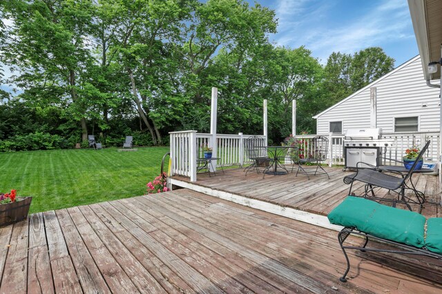 5035 Dietrich Ave, Orient, OH 43146 - wooden deck featuring a lawn, area for grilling, outdoor dining space, and view of wooded area