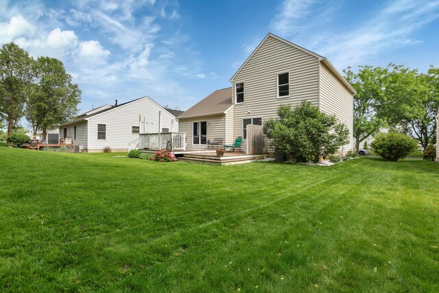 5035 Dietrich Ave, Orient, OH 43146 - back of property with a lawn, a wooden deck, and central AC unit