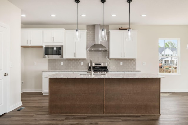 7014 Aster Way, Plain City, OH 43064 - kitchen featuring wall chimney exhaust hood, appliances with stainless steel finishes, a sink, dark wood-style floors, and baseboards