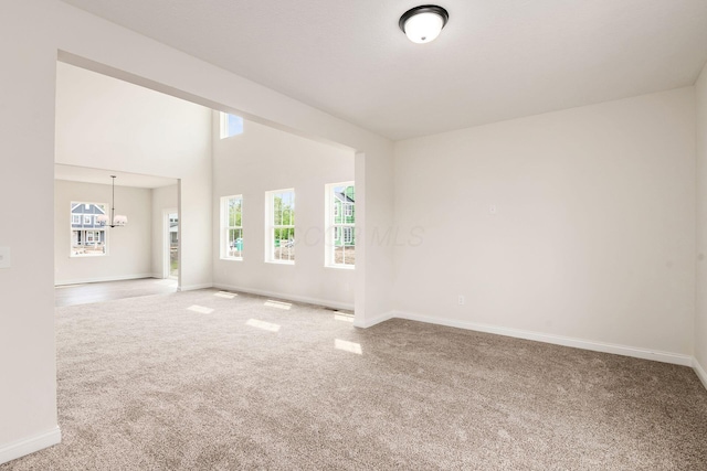 7014 Aster Way, Plain City, OH 43064 - spare room with carpet flooring, baseboards, and a chandelier