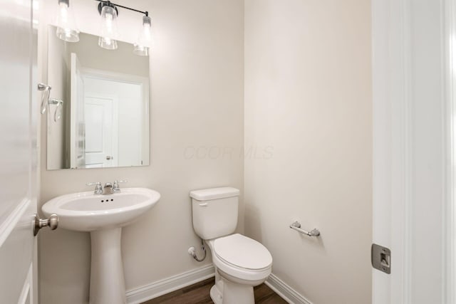 7014 Aster Way, Plain City, OH 43064 - bathroom with toilet, baseboards, wood finished floors, and a sink