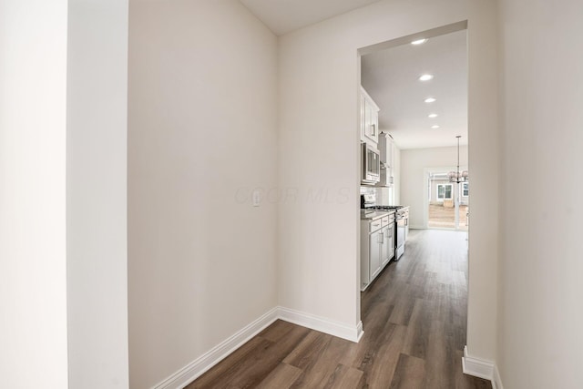 7014 Aster Way, Plain City, OH 43064 - hall with dark wood-style floors, baseboards, recessed lighting, and a chandelier