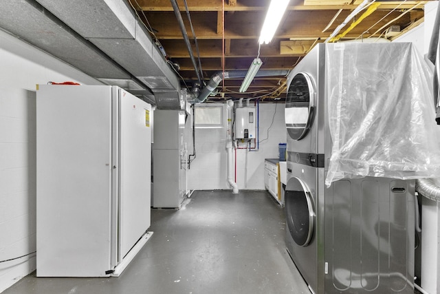 5280 Elmhurst Ave, Columbus, OH 43231 - basement with stacked washer / drying machine, water heater, heating unit, and freestanding refrigerator