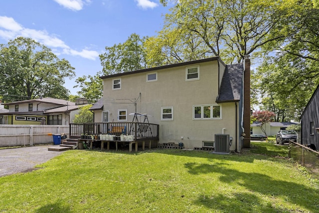 5280 Elmhurst Ave, Columbus, OH 43231 - rear view of property with central AC unit, a wooden deck, stucco siding, and a chimney