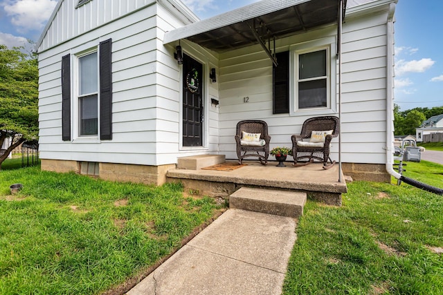 12 E Vine St, Jackson, OH 45640 - property entrance featuring a lawn and a porch
