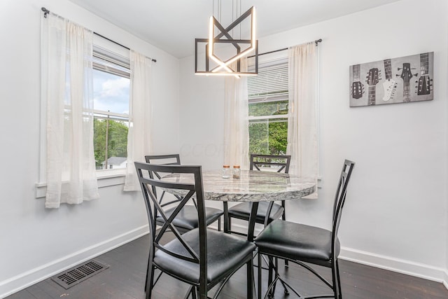 12 E Vine St, Jackson, OH 45640 - dining room with healthy amount of natural light, baseboards, dark wood-style flooring, and a chandelier