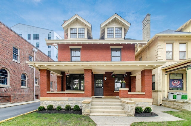 37 W 2nd Ave, Columbus, OH 43201 - traditional style home featuring a porch and brick siding